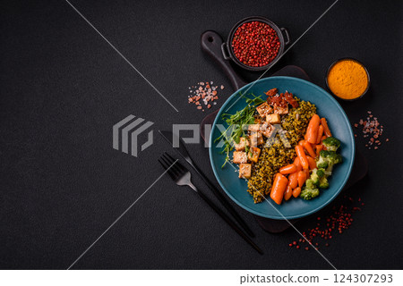 Quinoa bowl with tofu, steamed vegetables, grains, seeds and spices Quinoa bowl with tofu, steamed vegetables, grains, seeds and spices 124307293