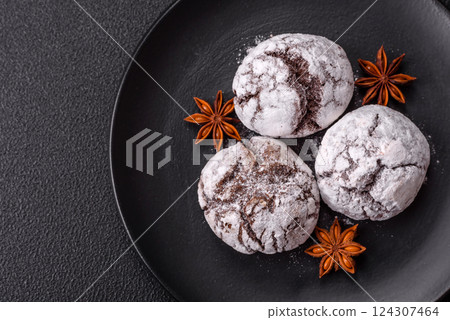 Delicious round freshly baked chocolate flavored cookies Delicious round freshly baked chocolate flavored cookies 124307464