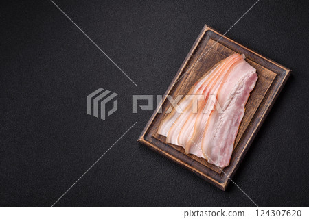 Fresh raw bacon sliced with spices and herbs 124307620