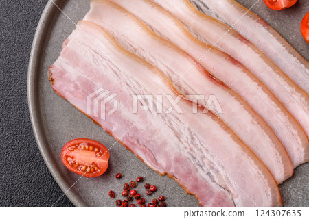 Fresh raw bacon sliced with spices and herbs Fresh raw bacon sliced with spices and herbs 124307635