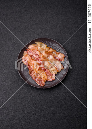 Delicious bacon in the form of slices with salt, spices and herbs 124307666