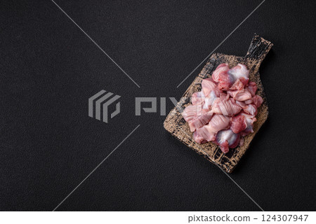 Raw chicken or turkey stomach with salt, spices and herbs 124307947