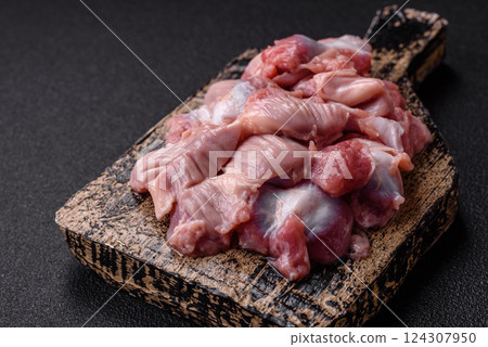 Raw chicken or turkey stomach with salt, spices and herbs Raw chicken or turkey stomach with salt, spices and herbs 124307950