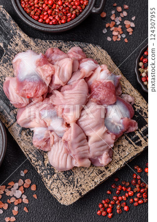 Raw chicken or turkey stomach with salt, spices and herbs Raw chicken or turkey stomach with salt, spices and herbs 124307955