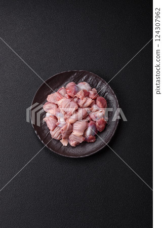 Raw chicken or turkey stomach with salt, spices and herbs 124307962