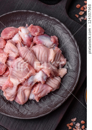 Raw chicken or turkey stomach with salt, spices and herbs 124307968
