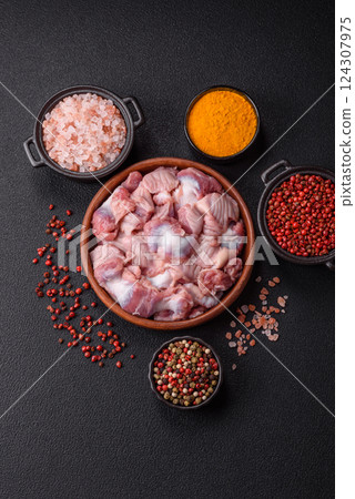 Raw chicken or turkey stomach with salt, spices and herbs 124307975