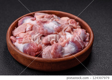 Raw chicken or turkey stomach with salt, spices and herbs 124307979
