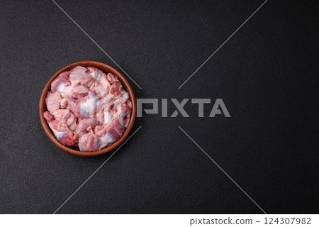 Raw chicken or turkey stomach with salt, spices and herbs Raw chicken or turkey stomach with salt, spices and herbs 124307982