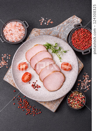 Meat, smoked, ham sliced with salt, spices and herbs 124308325