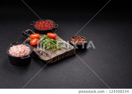 Sprigs of green fresh microgreen peas on wooden cutting board 124308334