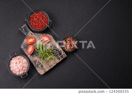 Sprigs of green fresh microgreen peas on wooden cutting board Sprigs of green fresh microgreen peas on wooden cutting board 124308335
