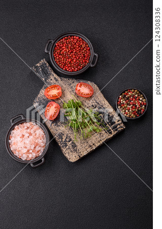 Sprigs of green fresh microgreen peas on wooden cutting board Sprigs of green fresh microgreen peas on wooden cutting board 124308336