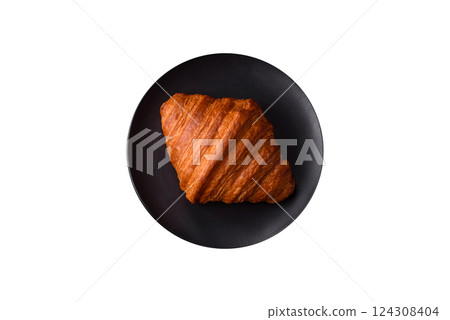Sweet fresh crispy croissant with chocolate filling 124308404