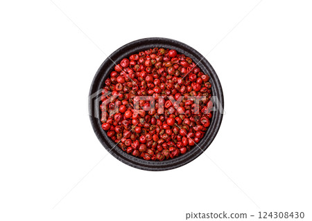 Spice, allspice peas in red or pink color in a bowl on a white background Spice, allspice peas in red or pink color in a bowl on a white background 124308430