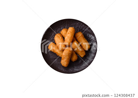 Delicious crispy cheese sticks with mozzarella, salt and spices Delicious crispy cheese sticks with mozzarella, salt and spices 124308437
