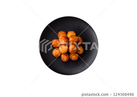 Delicious fried potato balls or croquettes with salt, spices and herbs Delicious fried potato balls or croquettes with salt, spices and herbs 124308498
