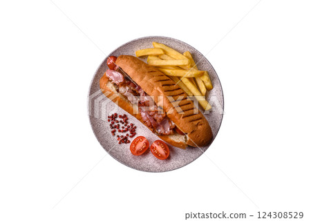 Delicious juicy hot dog with sausage, bacon, sauce, salt and spices 124308529