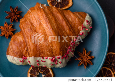 Crispy sweet red croissant with pistachio, raspberry and strawberry 124308671
