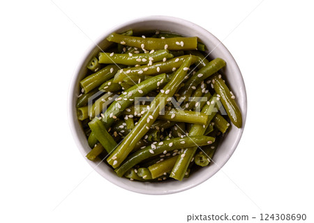 Steamed green beans on a plate with olive oil, sesame seeds Steamed green beans on a plate with olive oil, sesame seeds 124308690