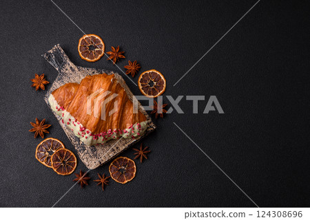 Crispy sweet red croissant with pistachio, raspberry and strawberry Crispy sweet red croissant with pistachio, raspberry and strawberry 124308696