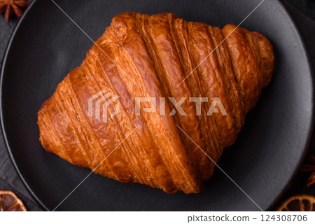 Sweet fresh crispy croissant with chocolate filling Sweet fresh crispy croissant with chocolate filling 124308706