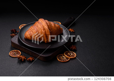 Sweet fresh crispy croissant with chocolate filling 124308708