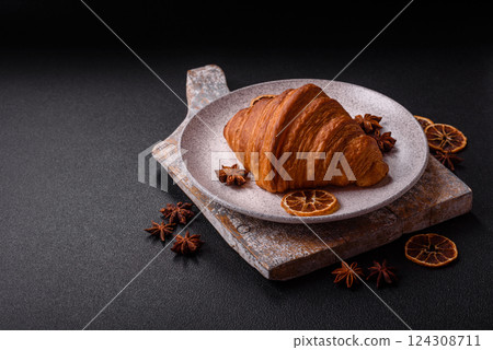 Sweet fresh crispy croissant with chocolate filling 124308711
