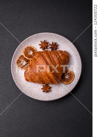 Sweet fresh crispy croissant with chocolate filling 124308722