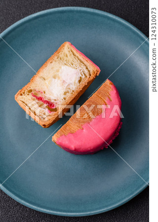 Round sweet New York roll croissant with raspberry cream filling Round sweet New York roll croissant with raspberry cream filling 124310073