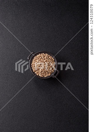 White allspice in a ceramic bowl 124310079