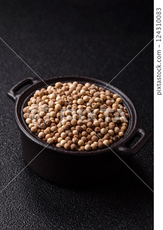 White allspice in a ceramic bowl 124310083