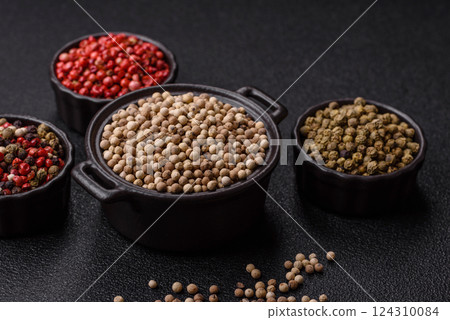 White allspice in a ceramic bowl 124310084