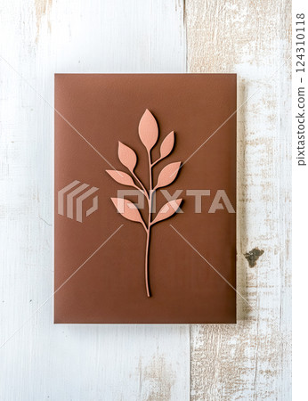 Elegant wedding invitation showing minimalist floral design on wooden background Elegant wedding invitation showing minimalist floral design on wooden background 124310118