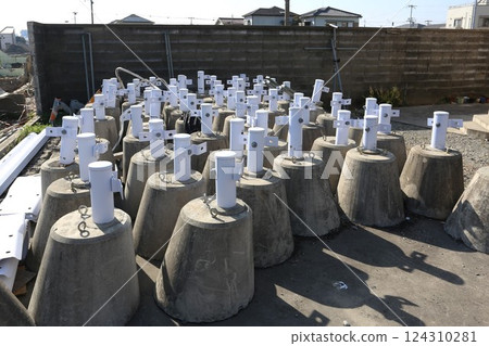 Temporary guardrail posts at road improvement construction site 124310281