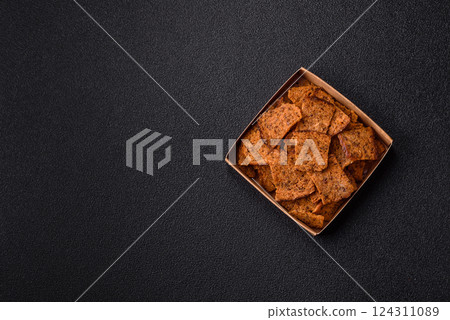 Crispy homemade brown bread chips with seeds and grains Crispy homemade brown bread chips with seeds and grains 124311089