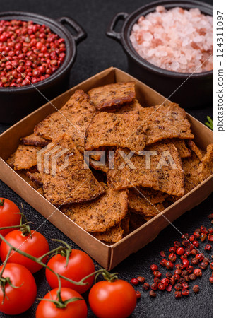 Crispy homemade brown bread chips with seeds and grains Crispy homemade brown bread chips with seeds and grains 124311097