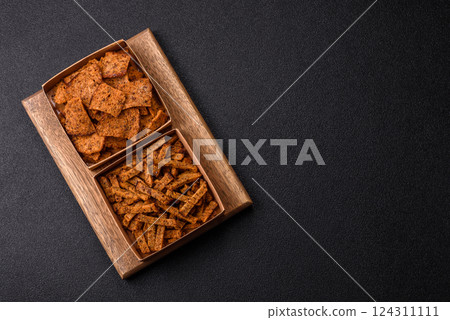 Crispy homemade brown bread crackers or croutons with seeds and grains Crispy homemade brown bread crackers or croutons with seeds and grains 124311111