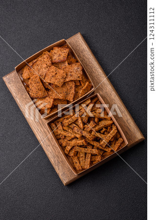 Crispy homemade brown bread crackers or croutons with seeds and grains Crispy homemade brown bread crackers or croutons with seeds and grains 124311112
