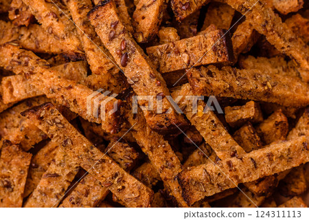 Crispy homemade brown bread crackers or croutons with seeds and grains 124311113