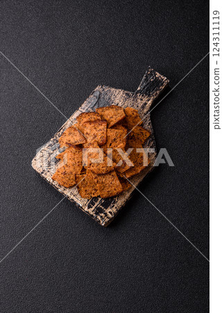 Crispy homemade brown bread chips with seeds and grains Crispy homemade brown bread chips with seeds and grains 124311119