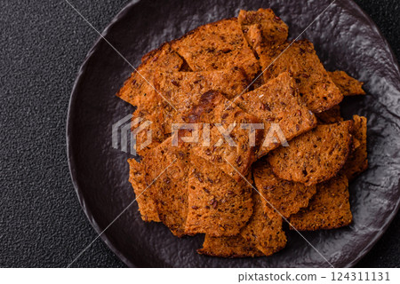 Crispy homemade brown bread chips with seeds and grains Crispy homemade brown bread chips with seeds and grains 124311131