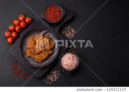 Crispy homemade brown bread chips with seeds and grains Crispy homemade brown bread chips with seeds and grains 124311137