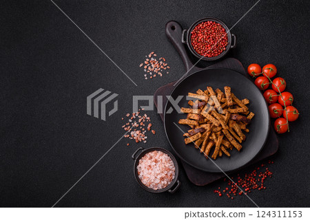 Crispy homemade brown bread crackers or croutons with seeds and grains Crispy homemade brown bread crackers or croutons with seeds and grains 124311153