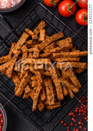 Crispy homemade brown bread crackers or croutons with seeds and grains 124311177