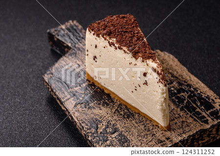 Delicious sweet piece of cheesecake with mascarpone cheese Delicious sweet piece of cheesecake with mascarpone cheese 124311252