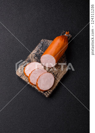 Delicious fresh ham cut into round slices with salt, spices and herbs 124311286