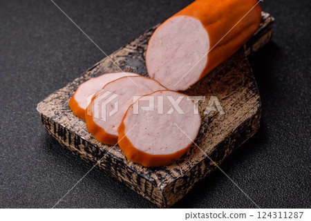 Delicious fresh ham cut into round slices with salt, spices and herbs 124311287