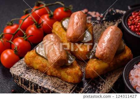 Hash browns with potatoes and onions, salt and spices Hash browns with potatoes and onions, salt and spices 124311427