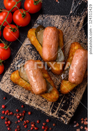 Hash browns with potatoes and onions, salt and spices Hash browns with potatoes and onions, salt and spices 124311429